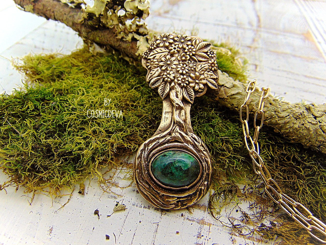 Express your love of life and nature with this intricately-crafted Tree of Life pendant necklace. Handcrafted from solid bronze with a beautiful emerald stone at its root, this unique piece of jewelry celebrates togetherness, growth, and individuality. Give yourself or a loved one the enduring gift of its timeless symbolism.