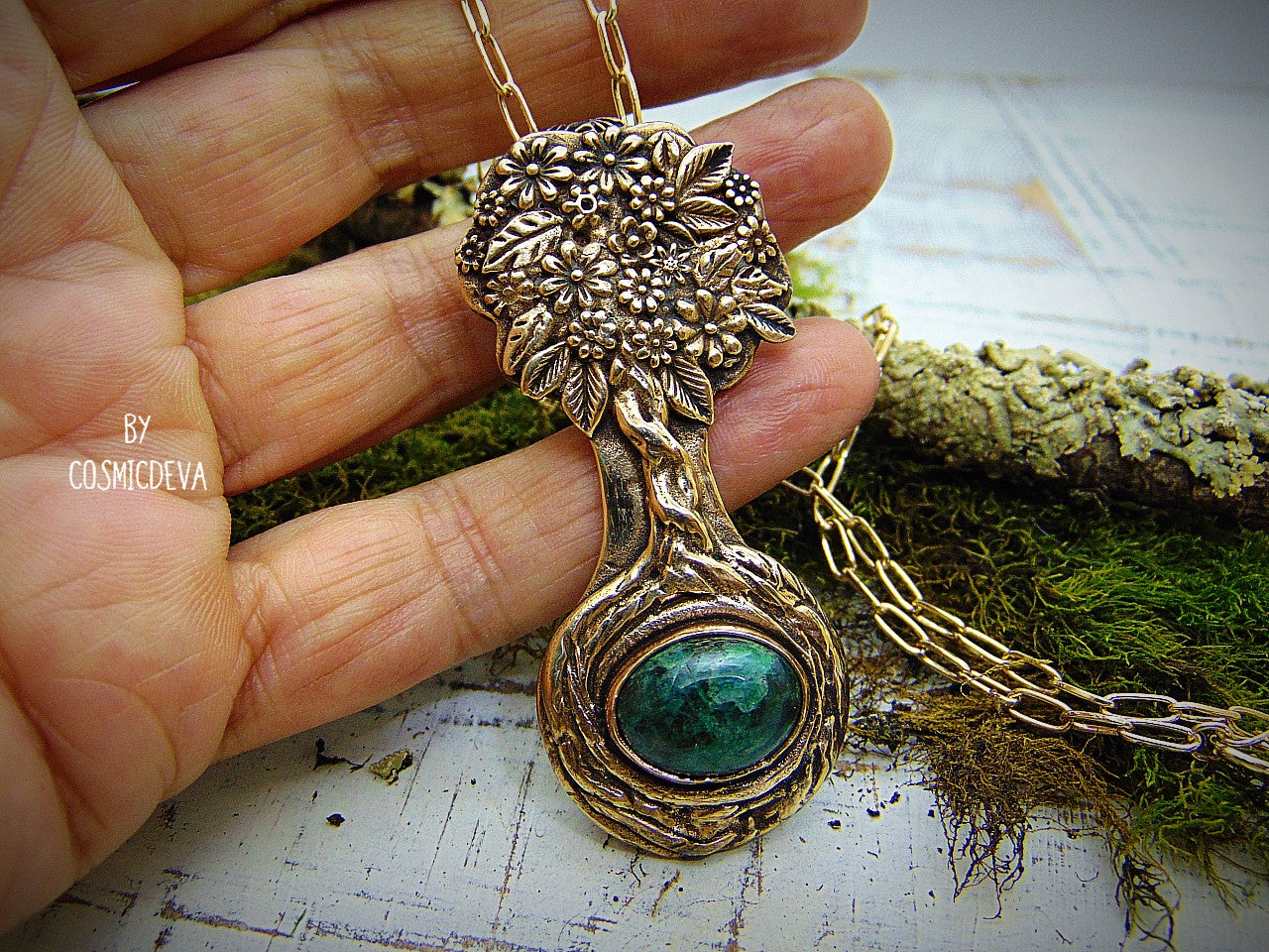 Express your love of life and nature with this intricately-crafted Tree of Life pendant necklace. Handcrafted from solid bronze with a beautiful emerald stone at its root, this unique piece of jewelry celebrates togetherness, growth, and individuality. Give yourself or a loved one the enduring gift of its timeless symbolism.