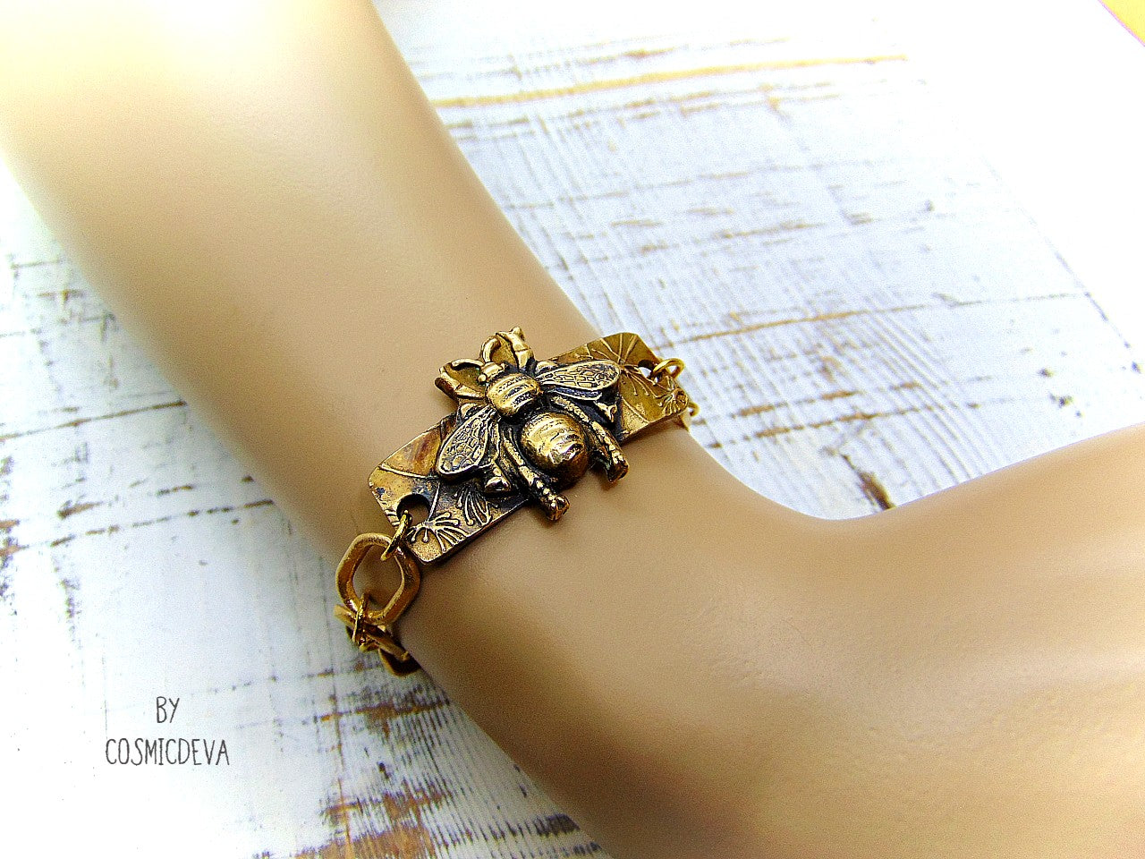 “Bee strong, Bee You, Bee Harmony” - Crafted with love and precision in our cozy Southeast Alabama home studio, this beautiful honeybee bracelet is a true work of art. Each element, from the radiant recycled pure gold bronze honeybee charm tag to the intricate oval chain links, is individually meticulously handcrafted, hand carved and kiln fired, ensuring a piece that is as unique as it is elegant.