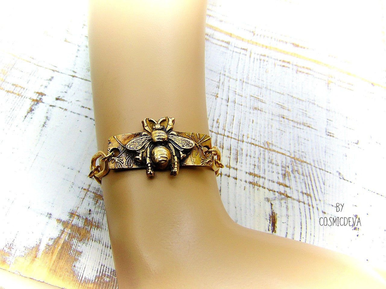“Bee strong, Bee You, Bee Harmony” - Crafted with love and precision in our cozy Southeast Alabama home studio, this beautiful honeybee bracelet is a true work of art. Each element, from the radiant recycled pure gold bronze honeybee charm tag to the intricate oval chain links, is individually meticulously handcrafted, hand carved and kiln fired, ensuring a piece that is as unique as it is elegant.