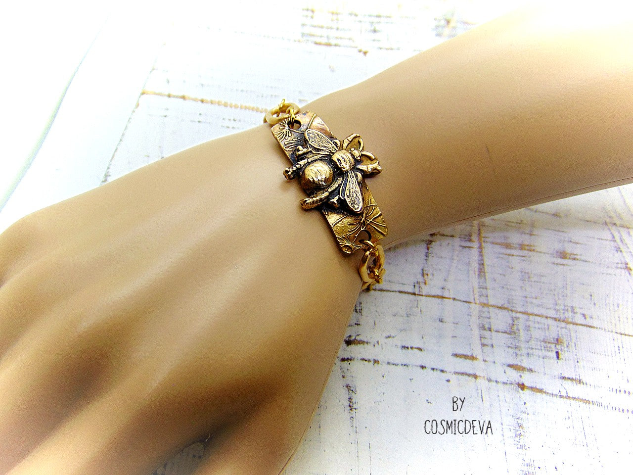 “Bee strong, Bee You, Bee Harmony” - Crafted with love and precision in our cozy Southeast Alabama home studio, this beautiful honeybee bracelet is a true work of art. Each element, from the radiant recycled pure gold bronze honeybee charm tag to the intricate oval chain links, is individually meticulously handcrafted, hand carved and kiln fired, ensuring a piece that is as unique as it is elegant.