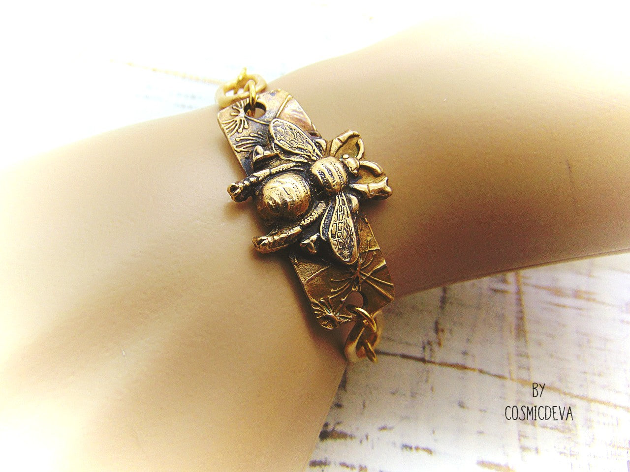 “Bee strong, Bee You, Bee Harmony” - Crafted with love and precision in our cozy Southeast Alabama home studio, this beautiful honeybee bracelet is a true work of art. Each element, from the radiant recycled pure gold bronze honeybee charm tag to the intricate oval chain links, is individually meticulously handcrafted, hand carved and kiln fired, ensuring a piece that is as unique as it is elegant.