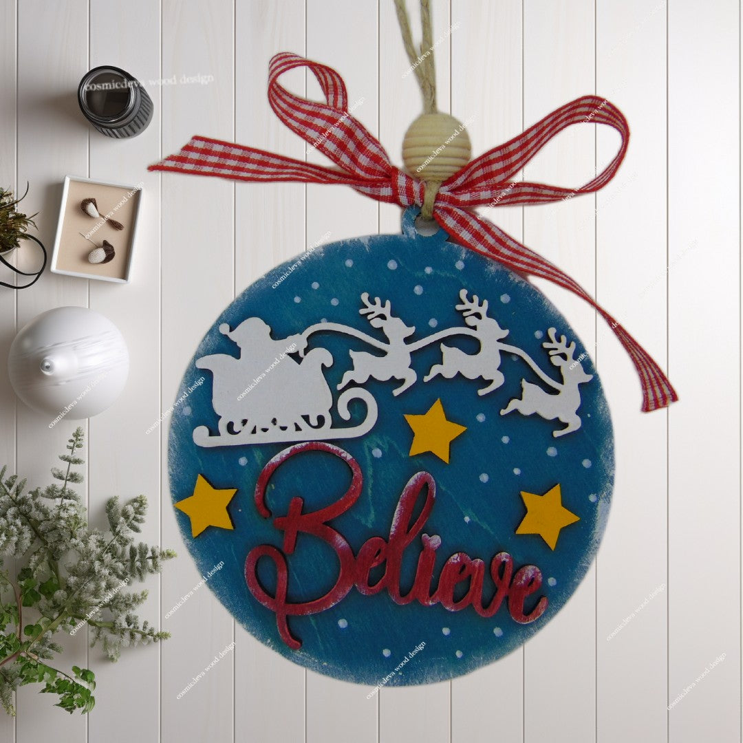 Celebrate the magic with a "Believe" Santa Sleigh wooden ornament. Hand-painted, 3D layered birch wood design with a polished, double-sided finish. Shop unique handmade holiday decor!