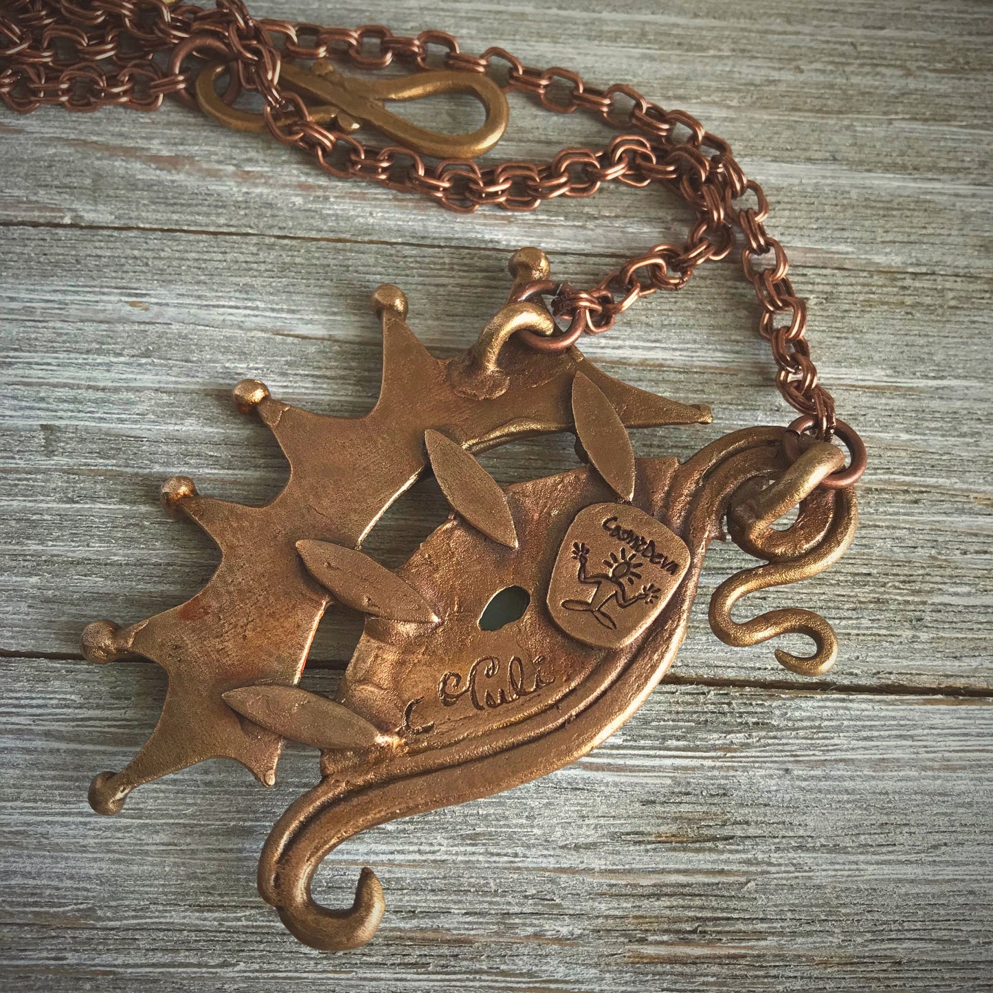 The Dragon is often seen as the guardian of a treasure. The treasure symbolizes you. This beautifully hand sculptured, carved, forged and kiln fired bronze pendant necklace symbolizes the Eye of a Dragon featuring a magical mystical shimmering labradorite gemstone. The reverse of the pendant is signed by the artist and carries the CosmicDeva brand hallmark.- CosmicDeva