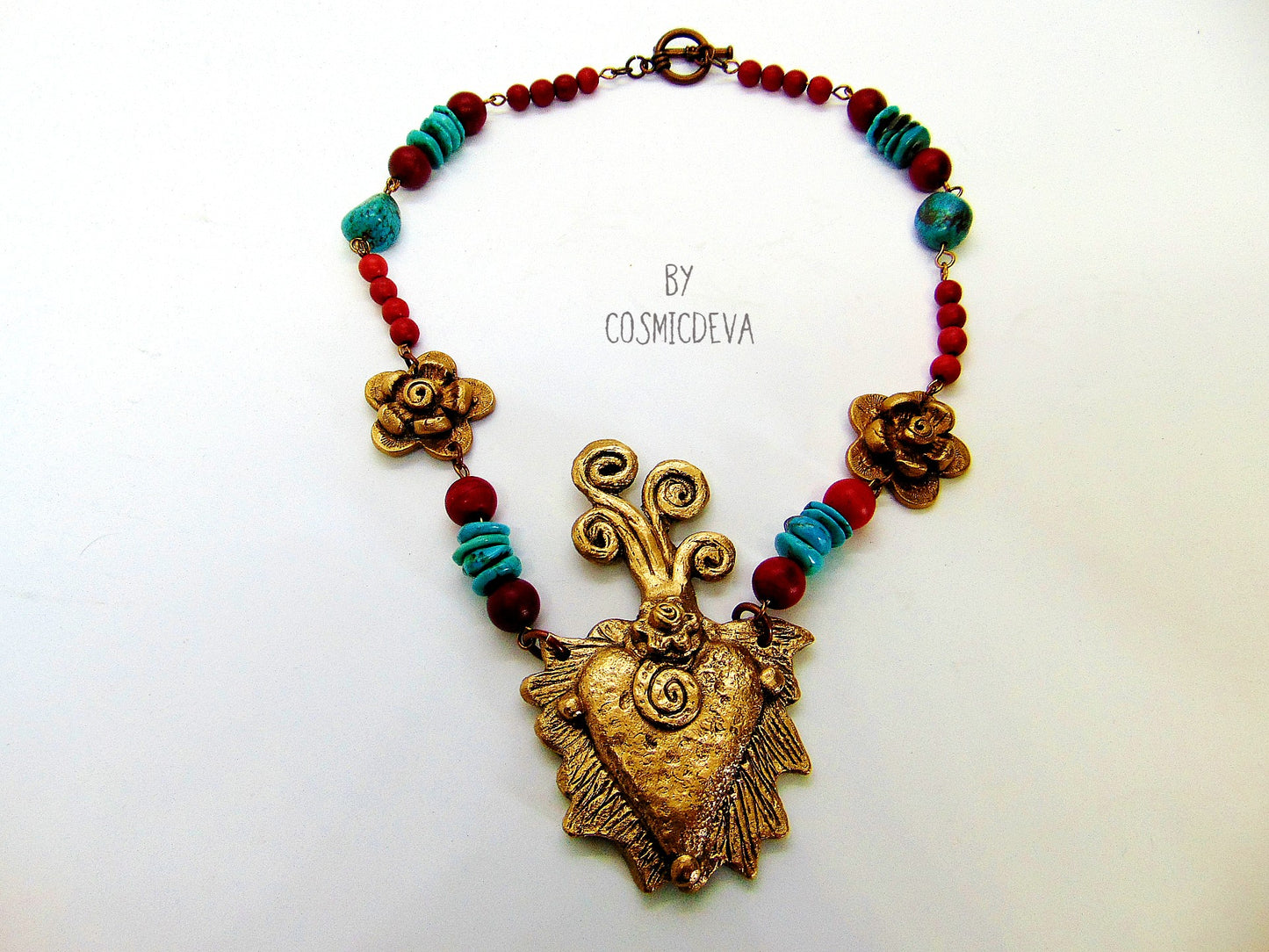 Gold Bronze Milagro Heart Sacred Heart Necklace Set. Stunning bold one of a kind hand sculptured solid golden bronze milagro heart and flower necklace set with natural turquoise, red howlite gemstone beads was kiln fired in my studio with pure Bronze from Bronze Metal Clay. This necklace comes with a matching pair of ear rings - CosmicDeva