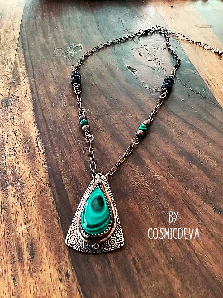 Wrap yourself in the irresistible beauty of nature with our Malachite Pendant Necklace. Handcrafted from pure copper and showcasing a stunning malachite gemstone cabochon, this gorgeous necklace is sure to be a conversation starter. Accented with malachite, volcanic rock, and copper beads- CosmicDeva