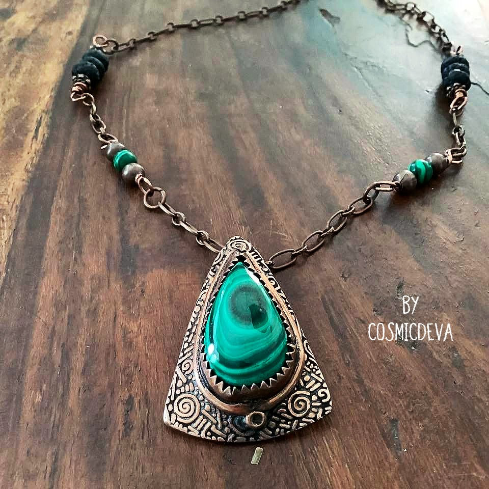 Wrap yourself in the irresistible beauty of nature with our Malachite Pendant Necklace. Handcrafted from pure copper and showcasing a stunning malachite gemstone cabochon, this gorgeous necklace is sure to be a conversation starter. Accented with malachite, volcanic rock, and copper beads- CosmicDeva