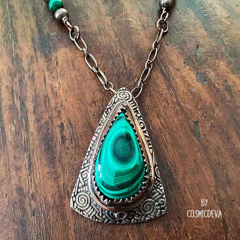 Wrap yourself in the irresistible beauty of nature with our Malachite Pendant Necklace. Handcrafted from pure copper and showcasing a stunning malachite gemstone cabochon, this gorgeous necklace is sure to be a conversation starter. Accented with malachite, volcanic rock, and copper beads- CosmicDeva