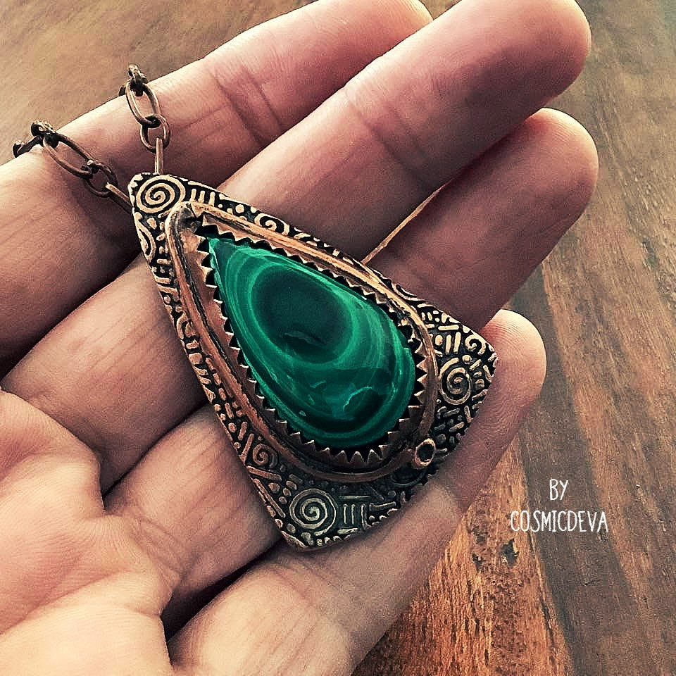 Wrap yourself in the irresistible beauty of nature with our Malachite Pendant Necklace. Handcrafted from pure copper and showcasing a stunning malachite gemstone cabochon, this gorgeous necklace is sure to be a conversation starter. Accented with malachite, volcanic rock, and copper beads- CosmicDeva