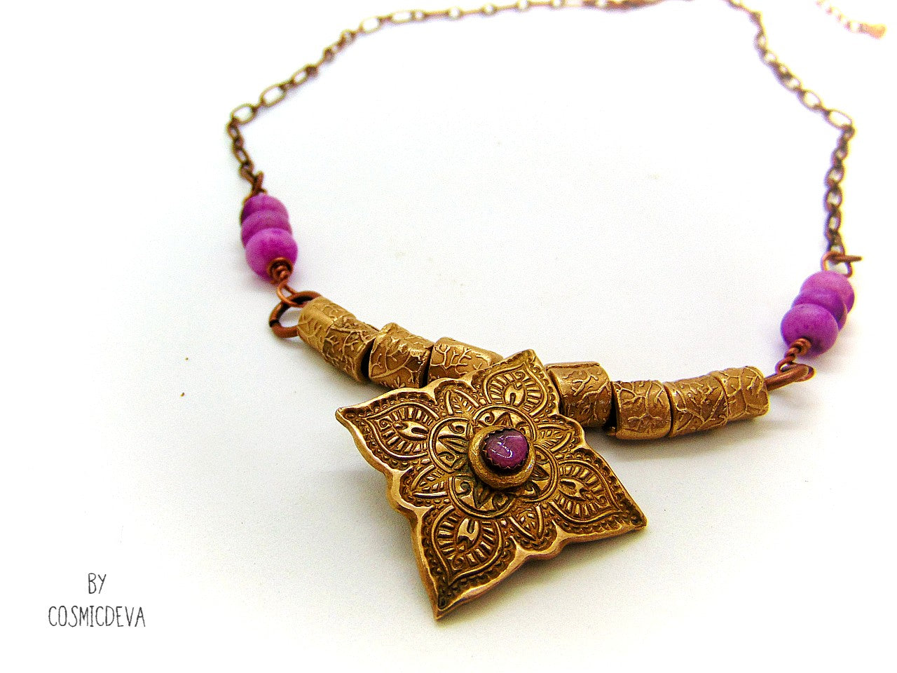 Enliven your wardrobe with this stunning Pink Tourmaline Mandala Mehndi Gold Bronze Necklace! Crafted with a unique hand formed bronze mandala pendant, pink tourmaline gemstone, and lovely pink jasper rondelle beads, this piece is perfect for yoga meditations or everyday wear. Adorn yourself with inspiring beauty!