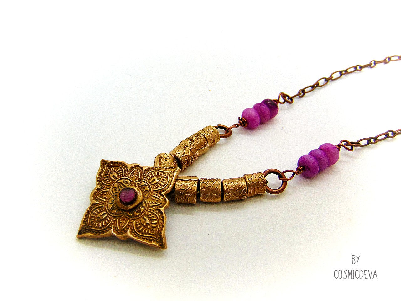 Enliven your wardrobe with this stunning Pink Tourmaline Mandala Mehndi Gold Bronze Necklace! Crafted with a unique hand formed bronze mandala pendant, pink tourmaline gemstone, and lovely pink jasper rondelle beads, this piece is perfect for yoga meditations or everyday wear. Adorn yourself with inspiring beauty!