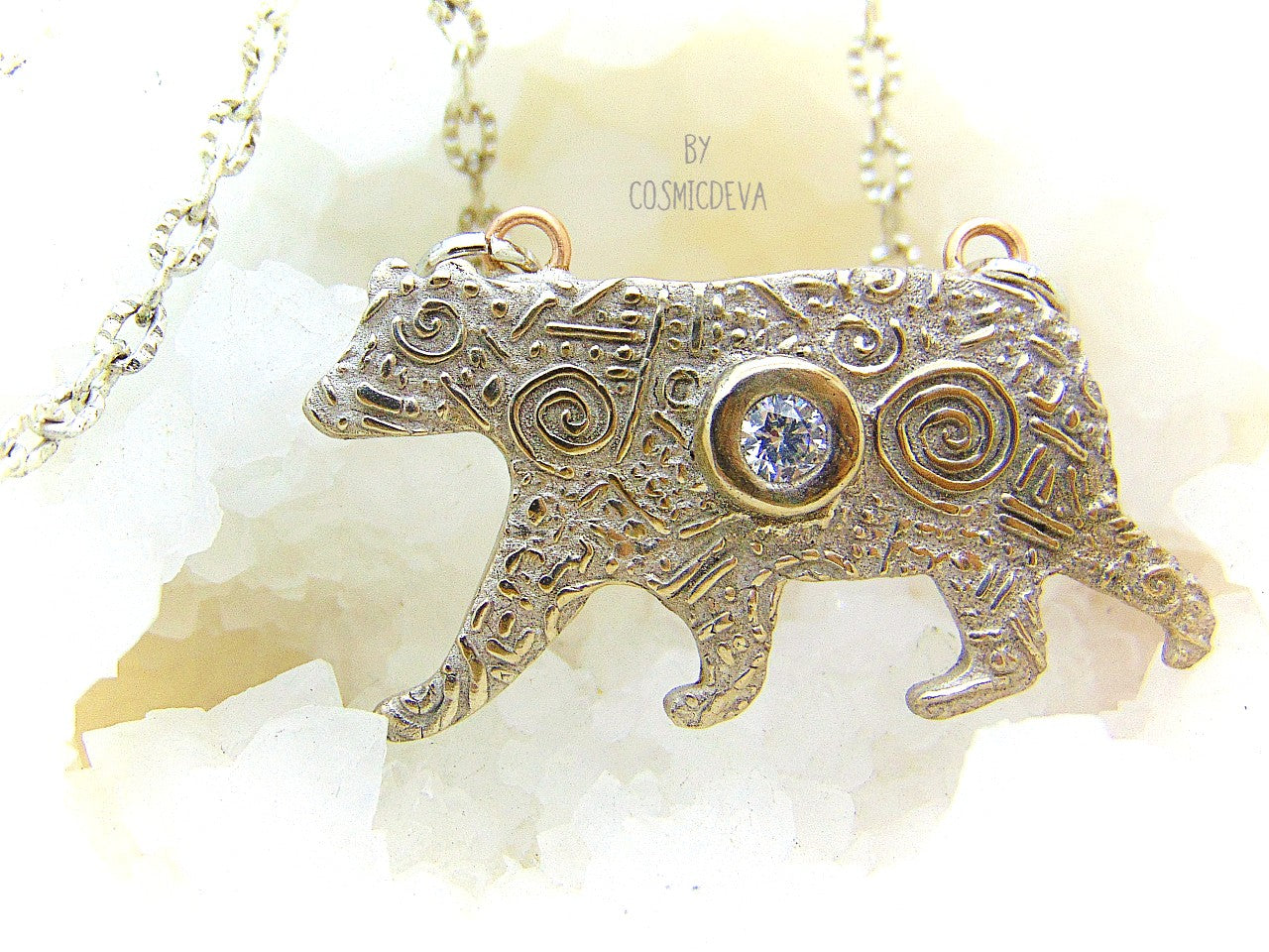 Inspire yourself to be strong and graceful like a polar bear with this handcrafted Silver Bear Spirit Animal Pendant Bronze Necklace. Crafted with a kiln fired silver bronze bear, accented with a diamond cut cubic zirconia gemstone, this pendant suspends from an 18-20 inch long chain. Wear this powerful piece and feel the power of the wild!