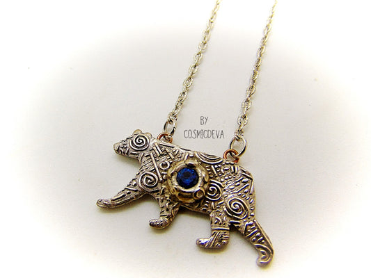 Bring the strength of your spirit animal home with this beautiful handcrafted polar bear pendant! Featuring a 5mm lab-grown blue spinel gemstone and a bronze finish, this necklace is strong and stylish. With a durable adjustable 18-20 inch chain, you can take the comforting power of your spirit animal with you wherever you go!