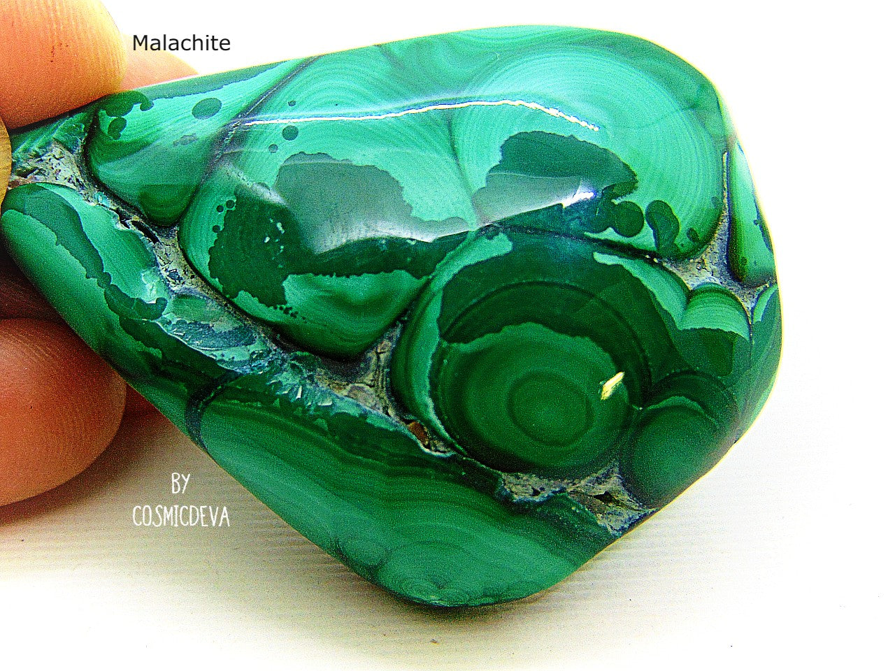 Outstanding and beautiful high quality polished botryoidal green malachite gemstone cabochon. Malachite is a copper ore mineral and has the reputation to protect against the evil eye, witchcraft and evil spirits. This beautiful malachite stone would be a great addition to you Chrystal collection, Chrystal healing or even for jewelry making.