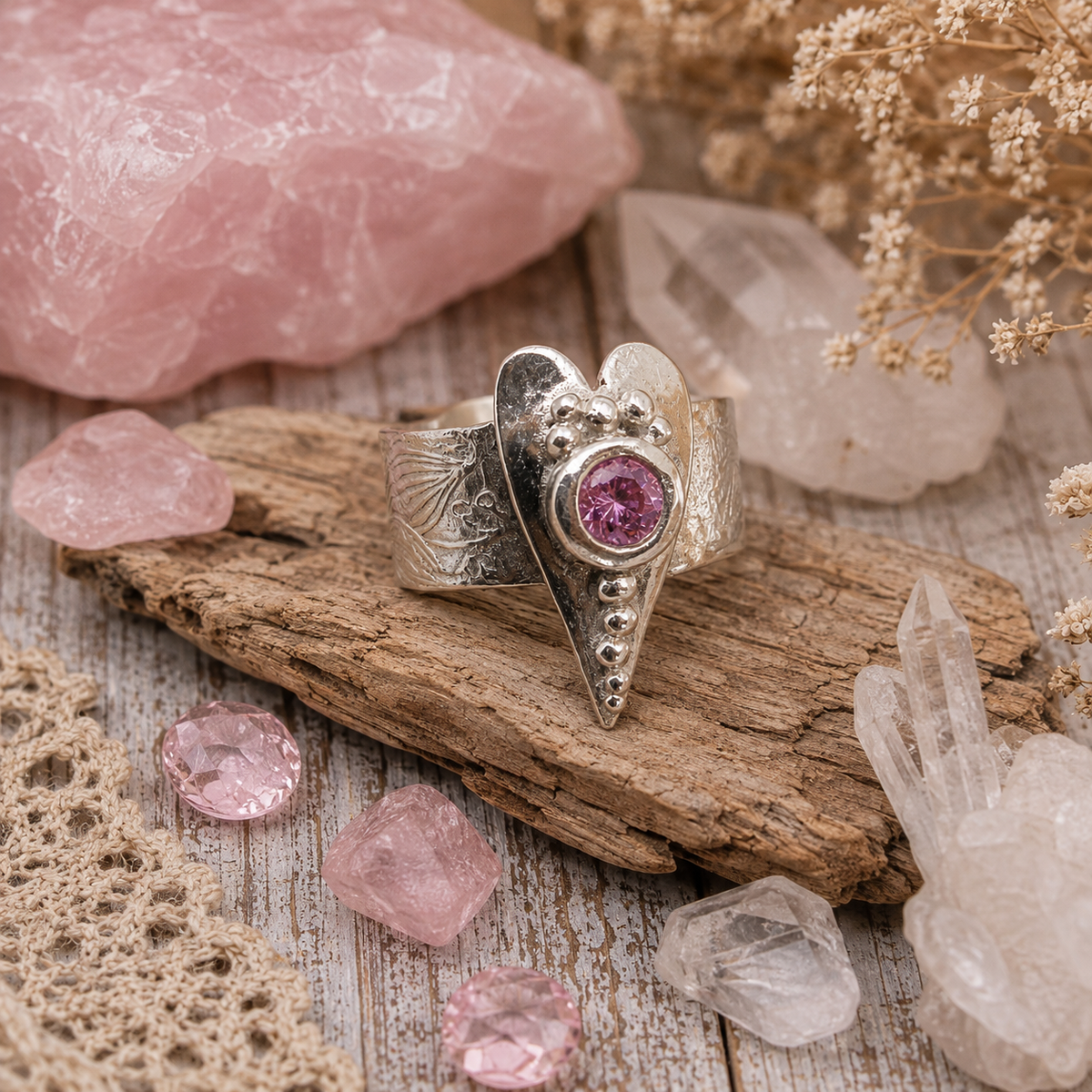Handmade .950 sterling silver heart ring with sparkling pink CZ gemstone and floral textured wide band. Romantic boho statement ring, size 8–8.5. by Cosmicdeva 