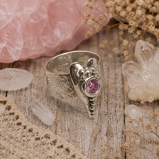 Handmade .950 sterling silver heart ring with sparkling pink CZ gemstone and floral textured wide band. Romantic boho statement ring, size 8–8.5. by Cosmicdeva 