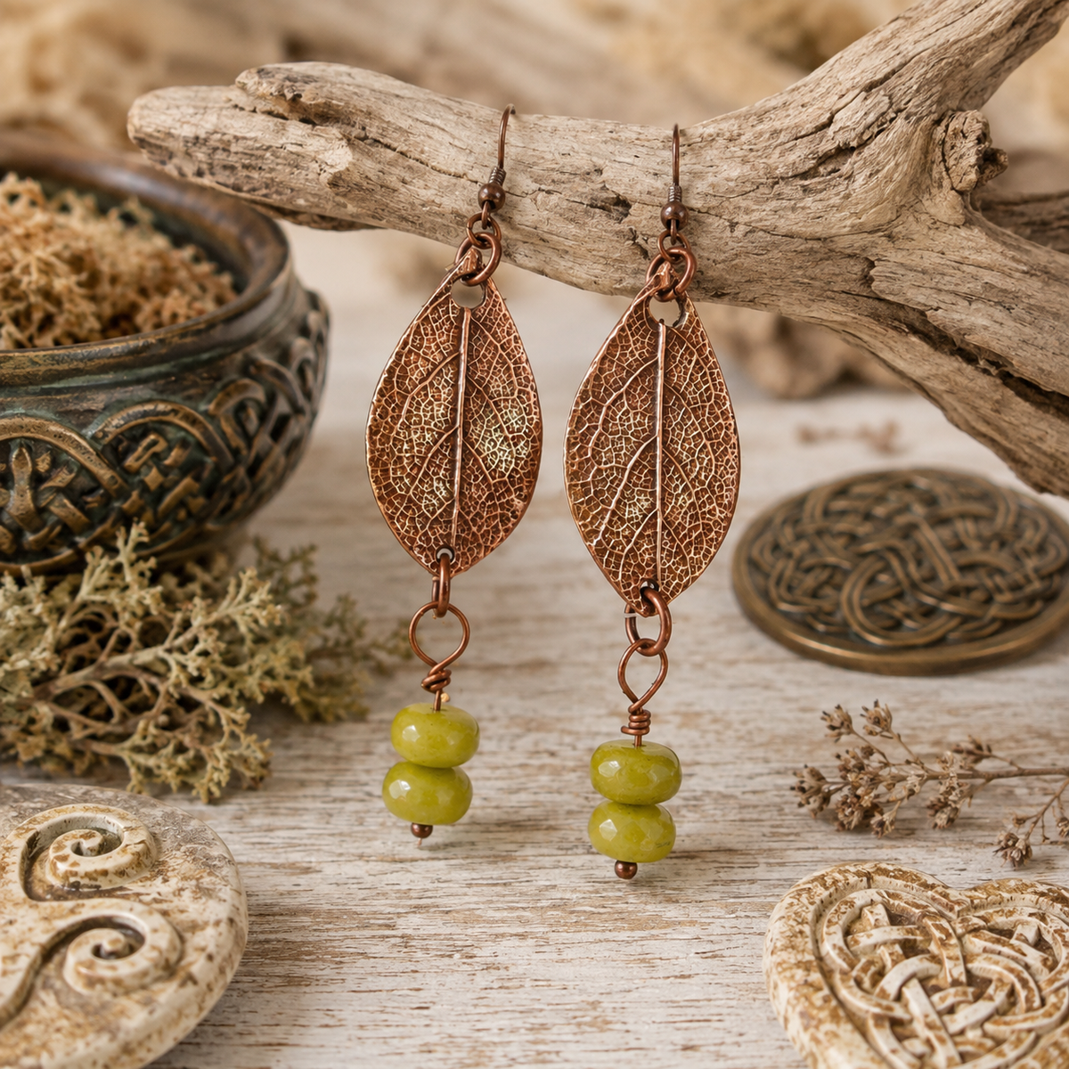 Handmade sage leaf copper earrings with apple green jade beads. Nature-inspired botanical boho earrings made in the USA—a unique gift for nature lovers. By cosmicdeva