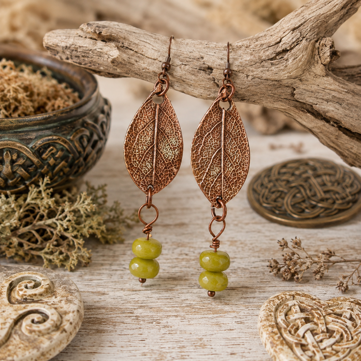 Handmade sage leaf copper earrings with apple green jade beads. Nature-inspired botanical boho earrings made in the USA—a unique gift for nature lovers. By cosmicdeva