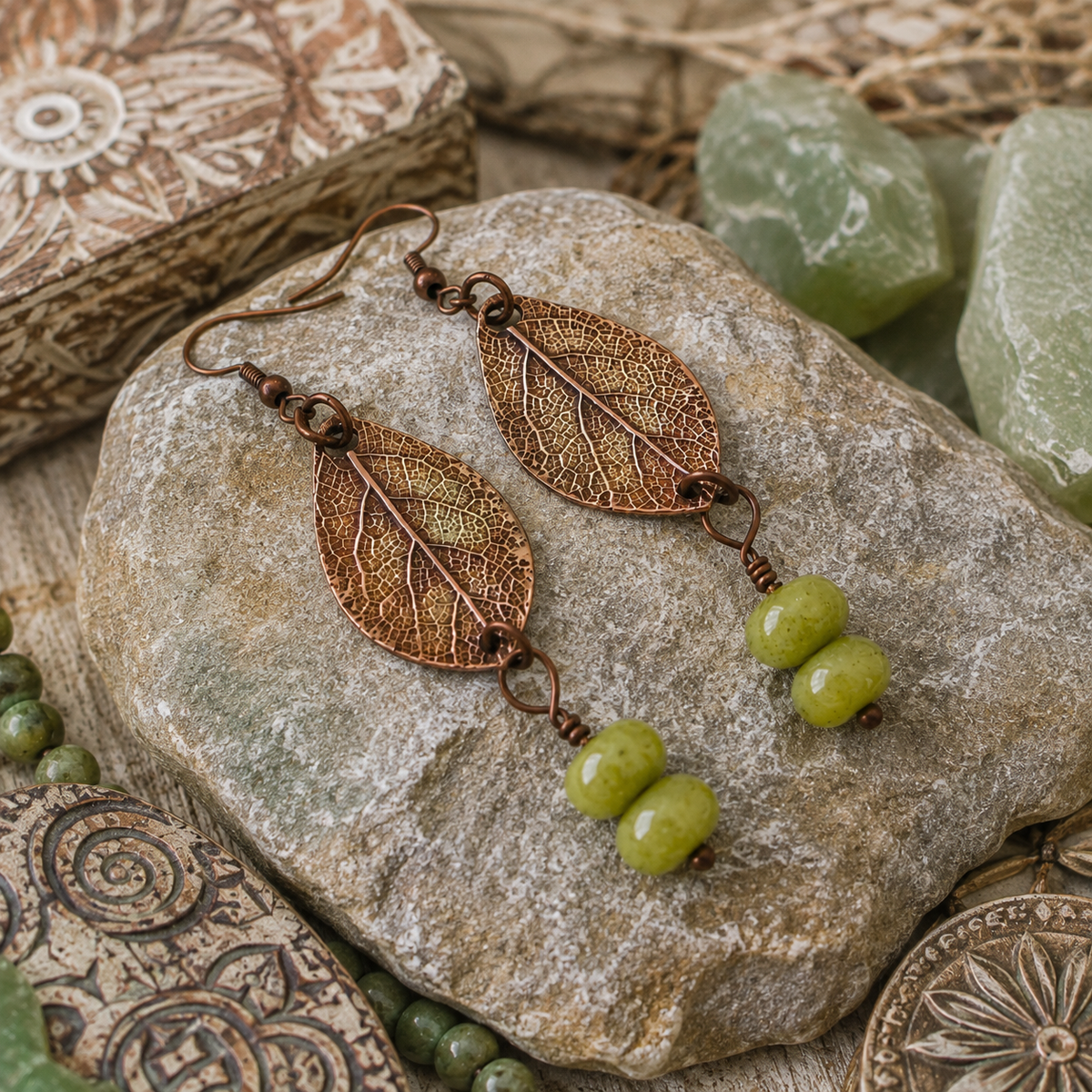 Handmade sage leaf copper earrings with apple green jade beads. Nature-inspired botanical boho earrings made in the USA—a unique gift for nature lovers. By cosmicdeva