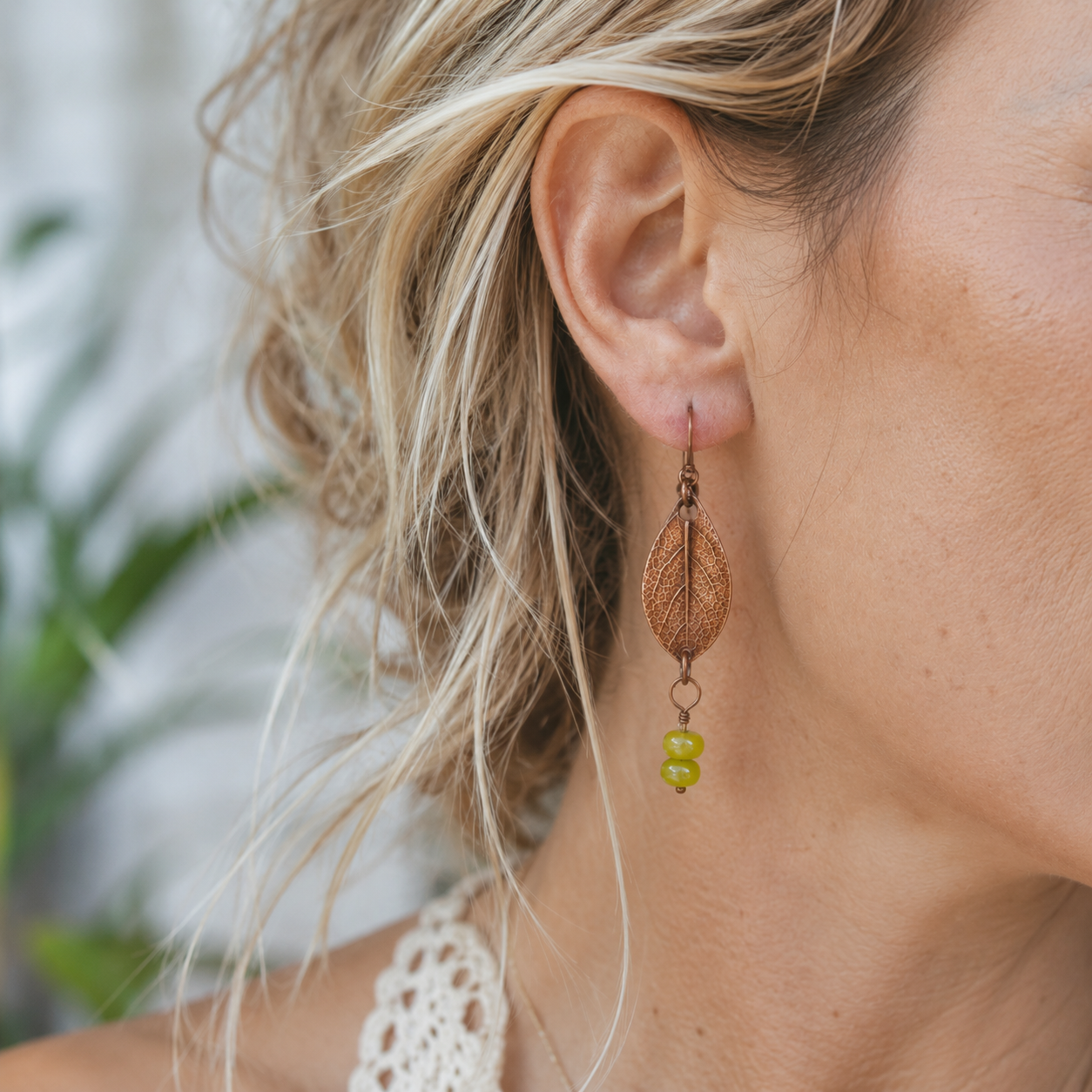 Handmade sage leaf copper earrings with apple green jade beads. Nature-inspired botanical boho earrings made in the USA—a unique gift for nature lovers. By cosmicdeva