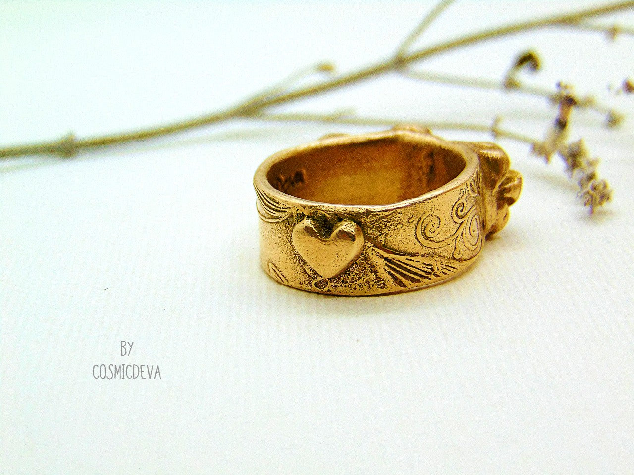 Handmade and hand formed unique organic solid gold bronze roman style ring featuring three roses with a heart 💕 on the bottom side.