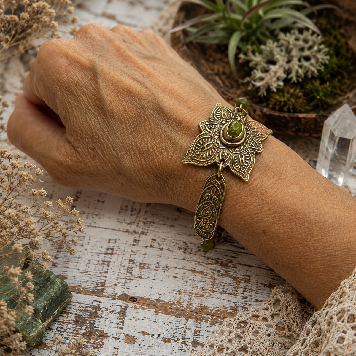Handmade Elven bronze bracelet with natural green peridot, ornate mandala details and artisan toggle clasp. Unique boho August birthstone jewelry.