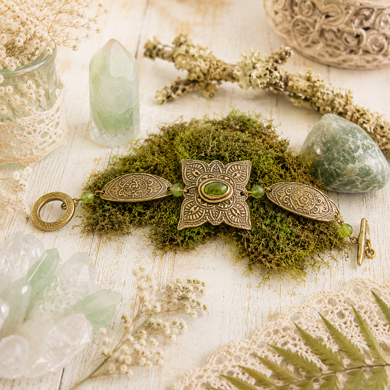 Handmade Elven bronze bracelet with natural green peridot, ornate mandala details and artisan toggle clasp. Unique boho August birthstone jewelry.