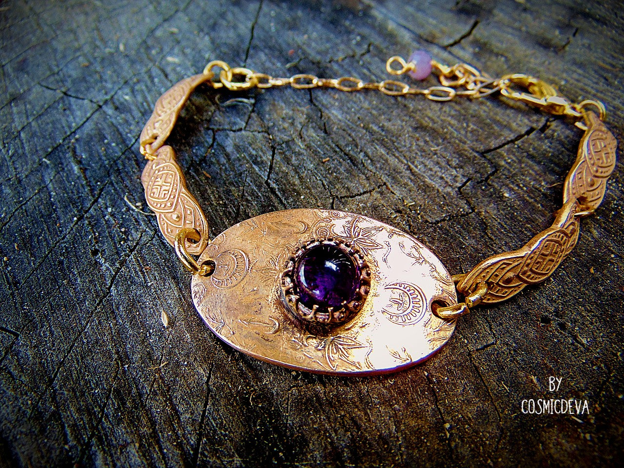 This one-of-a-kind piece is formed with love and care, reflecting a unique filigree design reminiscent of elven artistry. The artisan bracelet is adorned with natural amethyst, a gemstone known for its stunning purple hue and calming properties. The hand-formed chain links are meticulously designed with a medieval texture, adding an element of historical charm to the piece