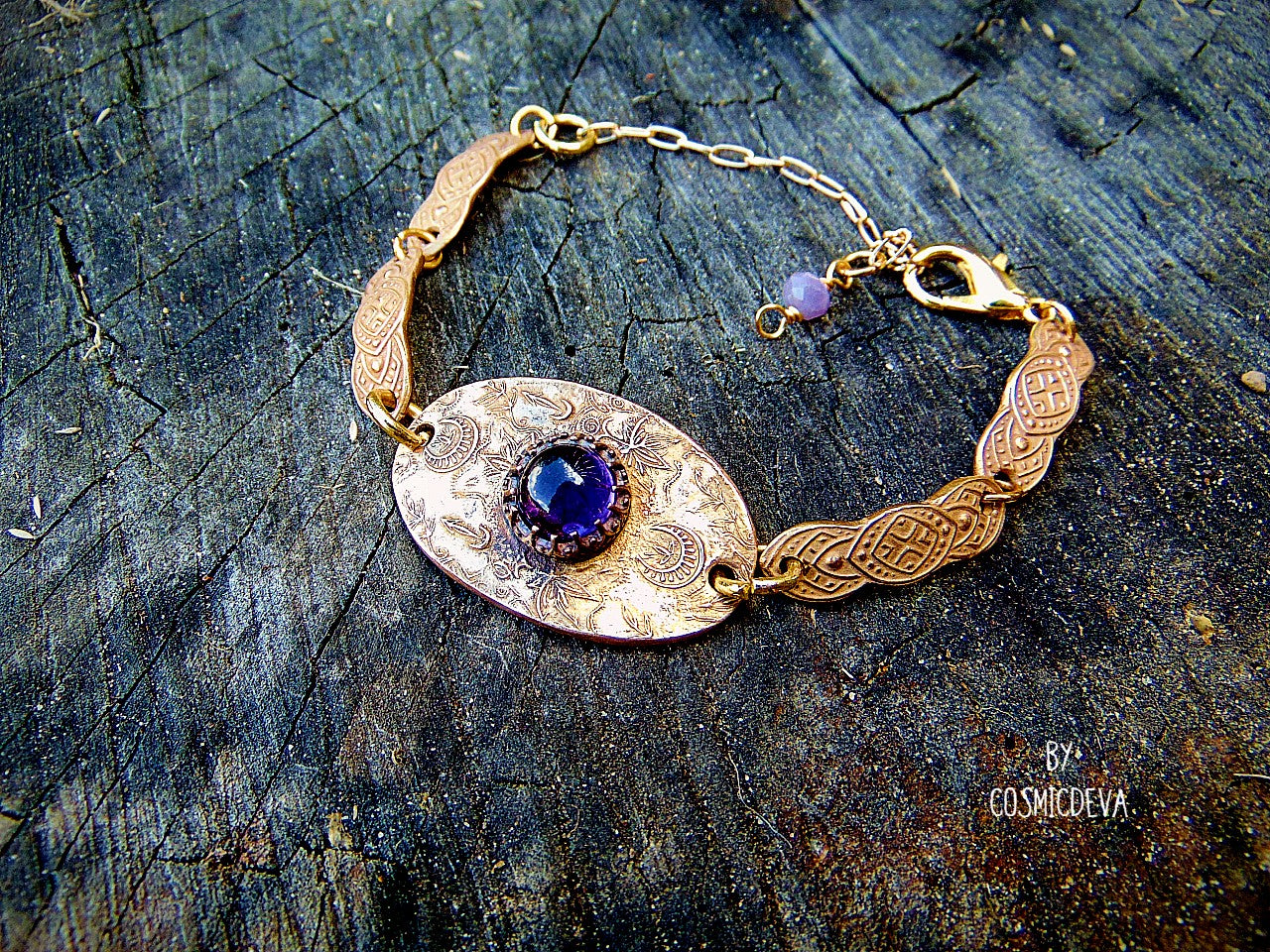 This one-of-a-kind piece is formed with love and care, reflecting a unique filigree design reminiscent of elven artistry. The artisan bracelet is adorned with natural amethyst, a gemstone known for its stunning purple hue and calming properties. The hand-formed chain links are meticulously designed with a medieval texture, adding an element of historical charm to the piece