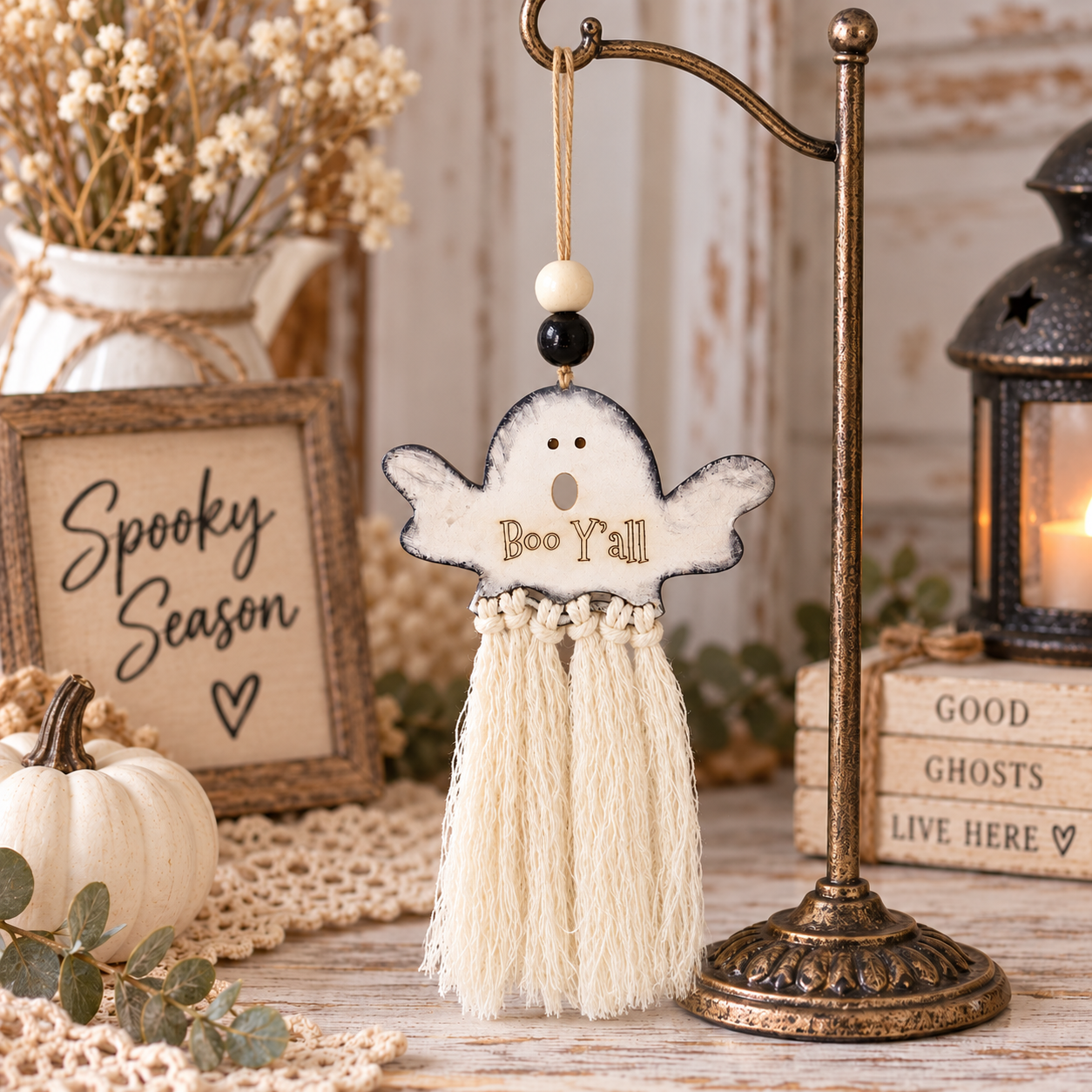 Handmade Halloween ghost car charm with white macramé tassel, wooden beads and double-sided Boo Y’all / No Tricks, just treats engraving. Made By Cosmicdeva 