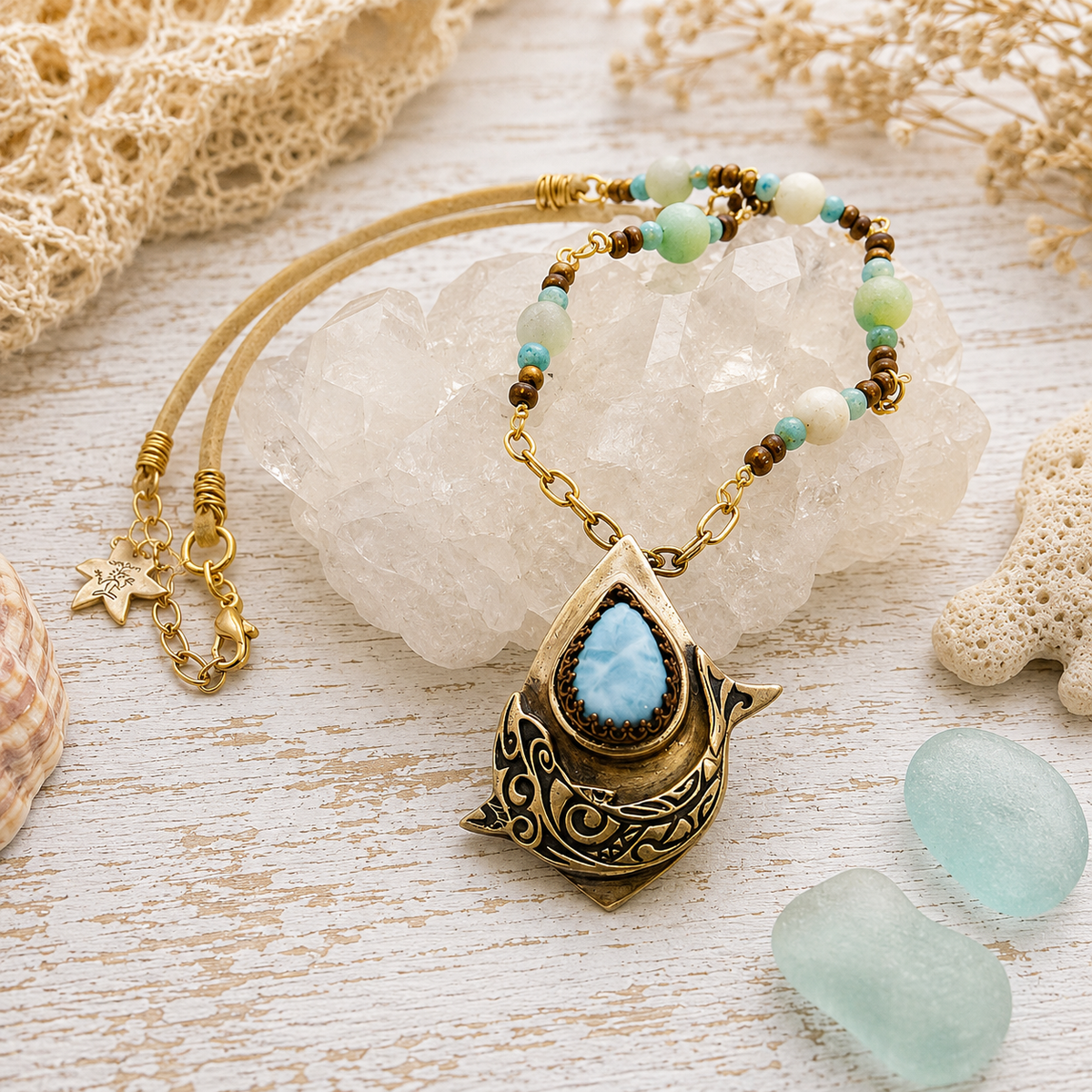 Handmade Larimar dolphin necklace featuring a solid bronze dolphin pendant, Caribbean blue Larimar, amazonite and jasper beads. Unique boho ocean jewelry.