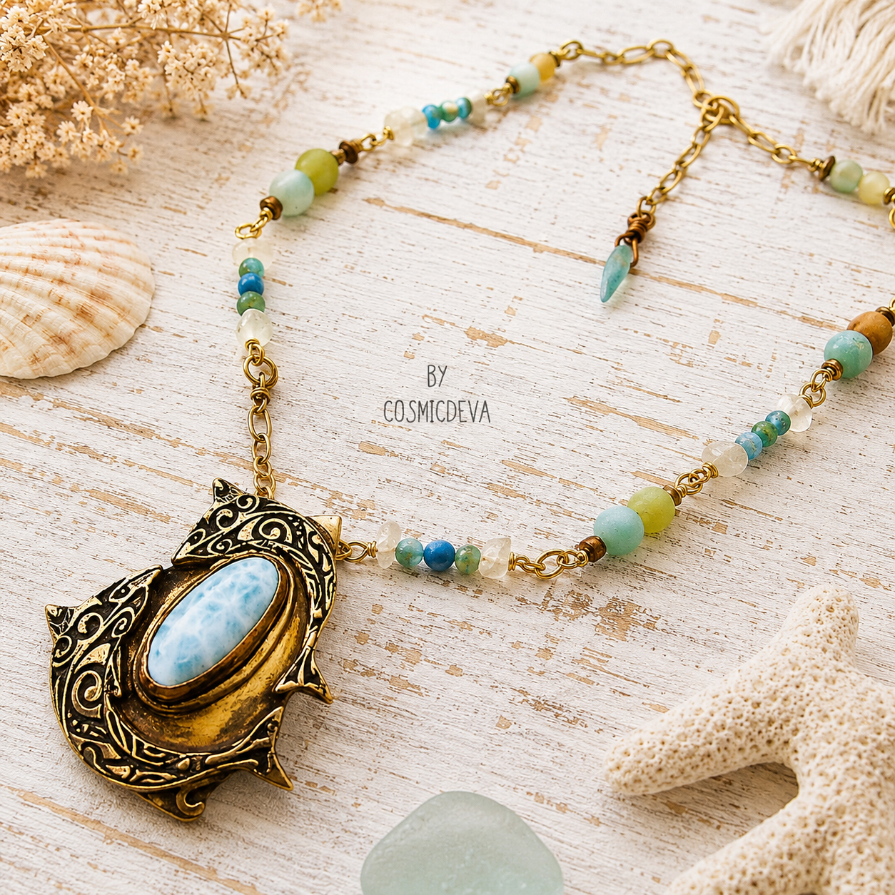 Handmade Larimar dolphin necklace featuring a solid bronze dolphin pendant, Caribbean blue Larimar, amazonite and jasper beads. Unique boho ocean jewelry.