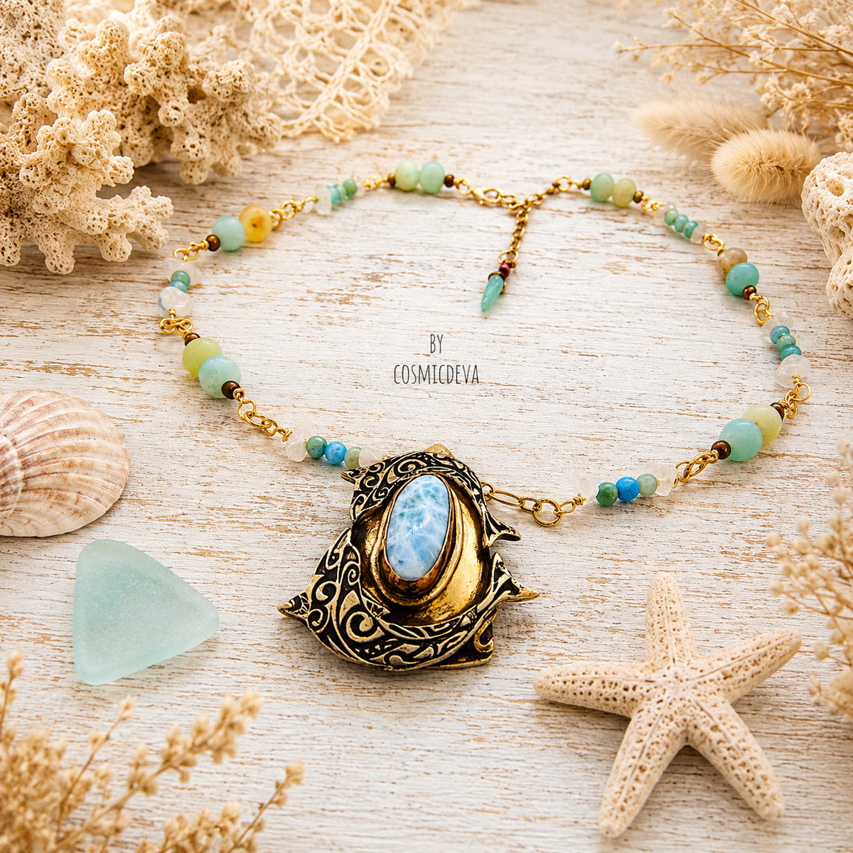 Handmade Larimar dolphin necklace featuring a solid bronze dolphin pendant, Caribbean blue Larimar, amazonite and jasper beads. Unique boho ocean jewelry.