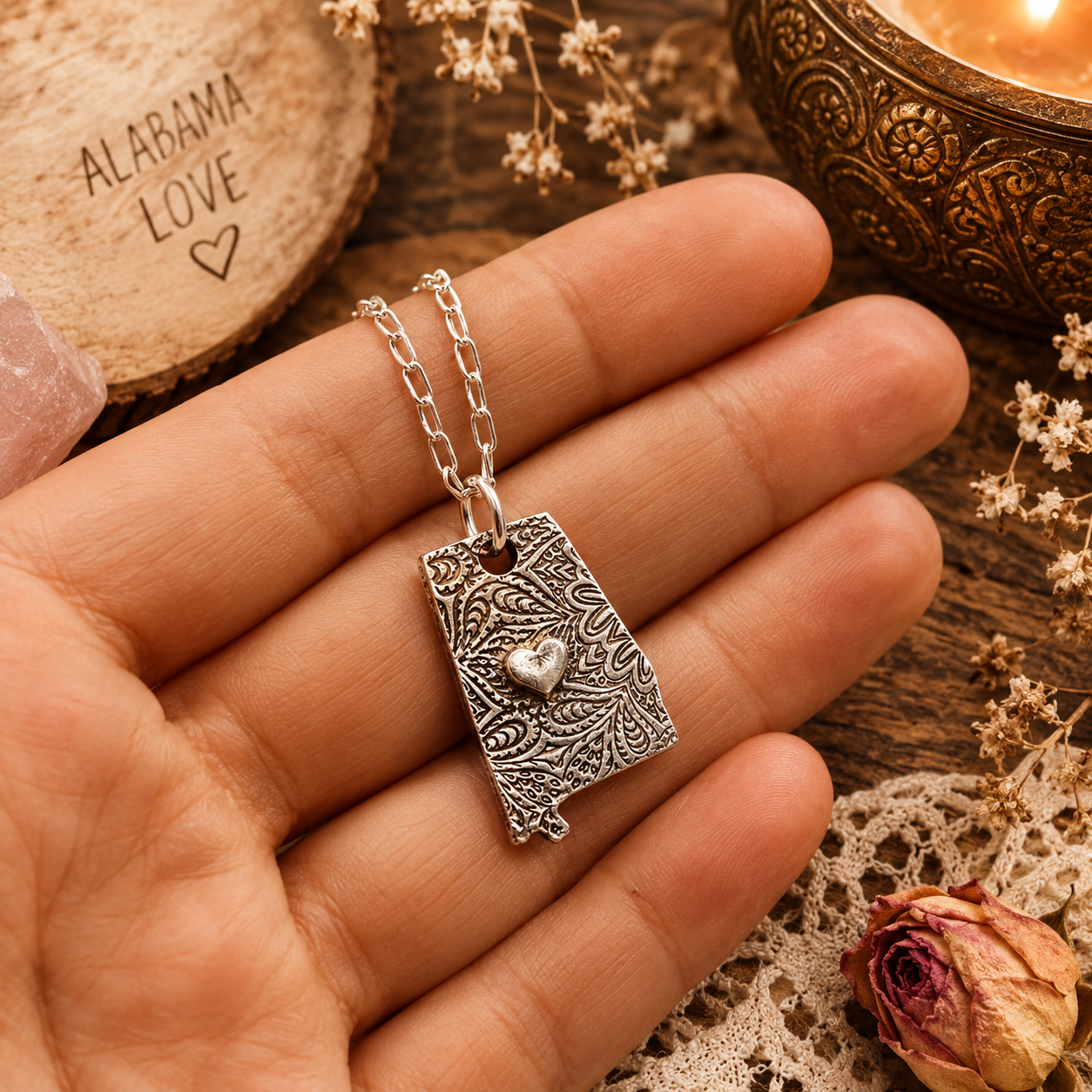 Shine your love for Alabama with this stunningly handcrafted and kiln-fired sterling silver necklace, featuring a delicate Alabama-shaped pendant with a heart in the center.  Alabama love never looked so beautiful!