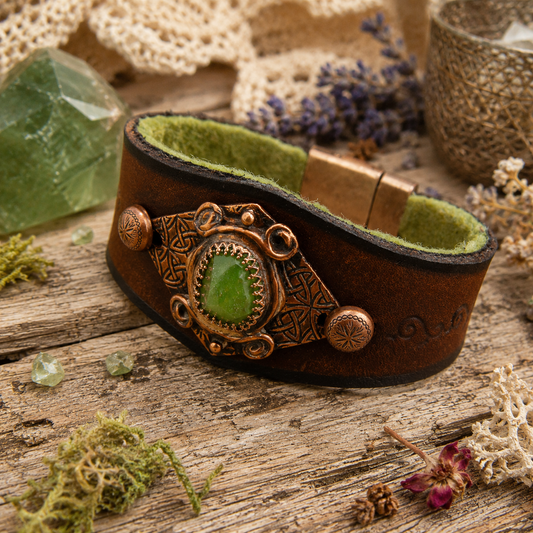 One-of-a-kind green Peridot leather cuff with Celtic textured copper, brown VegTan leather and magnetic clasp. Handmade boho artisan jewelry. By Cosmicdeva 