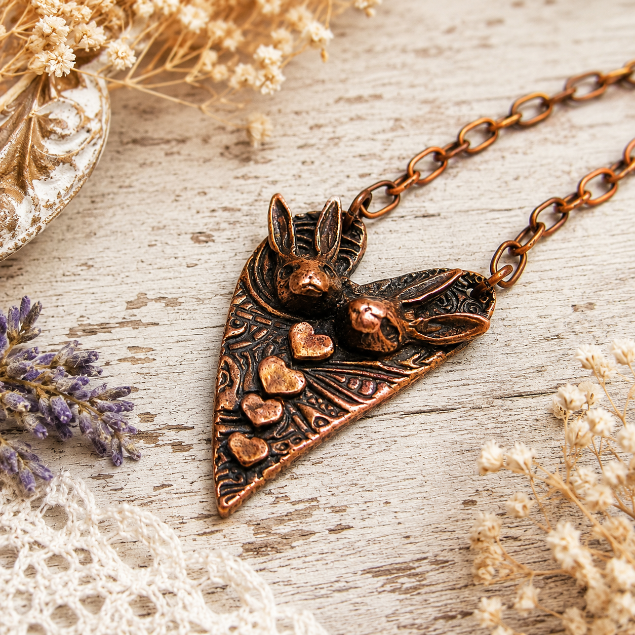Handmade Bunny Love copper necklace featuring two rabbits and tiny hearts. One-of-a-kind boho rabbit pendant jewelry and romantic gift for her. By Cosmicdeva