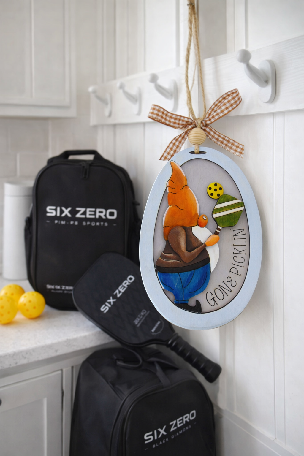 Hand painted 3D Pickleball Gnome Ornament with orange cap. Layered birch wood décor for year round pickleball lovers. Great gift for players, coaches, and fans.