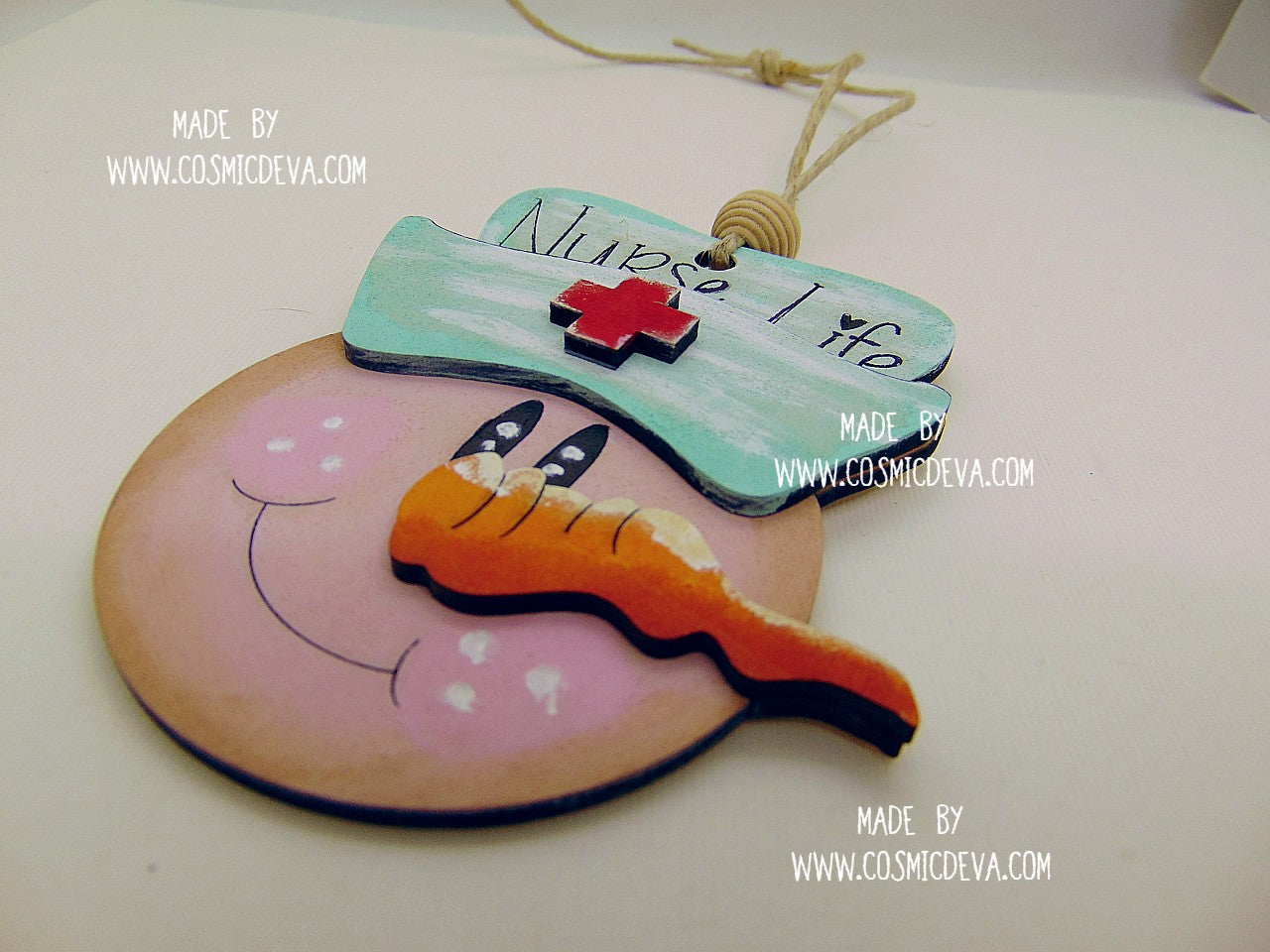 Hand painted Wooden Nurse Snowman Christmas Ornament with layered basswood design and engraved “Nurse Life” lettering. A perfect Christmas gift for nurses, nursing students, and healthcare workers.