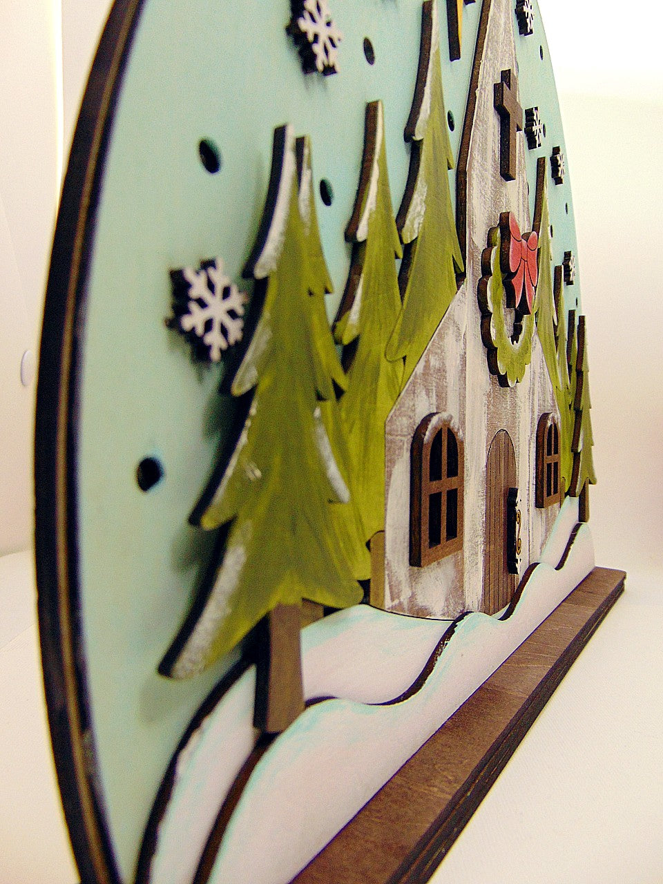 Lighted layered wood Church Christmas shelf sitter featuring a snowy winter scene, glowing windows, and embedded LED lights. Perfect rustic holiday décor for mantels, entry tables, and faith inspired Christmas displays. Handmade and beautifully detailed.