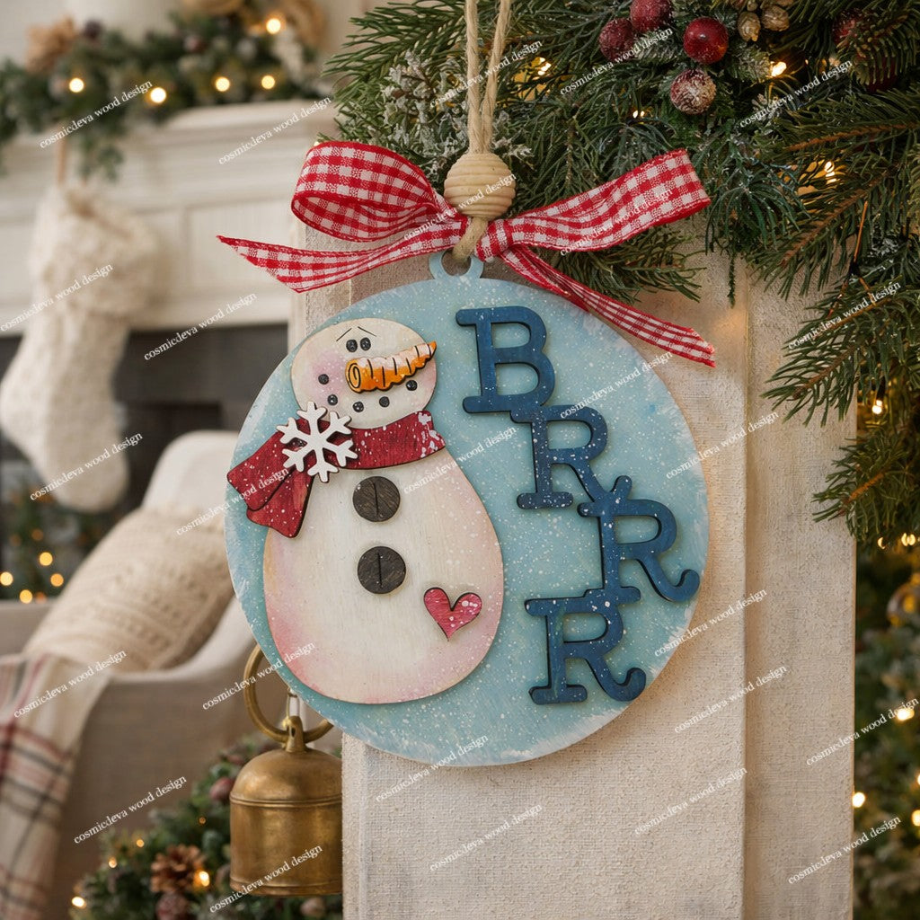 Add whimsical charm to your tree with our laser-cut Snowman Wood Ornament. Hand-painted with a red scarf and "Brrr" detail. High-quality 3.5" birch wood decor. Shop now!