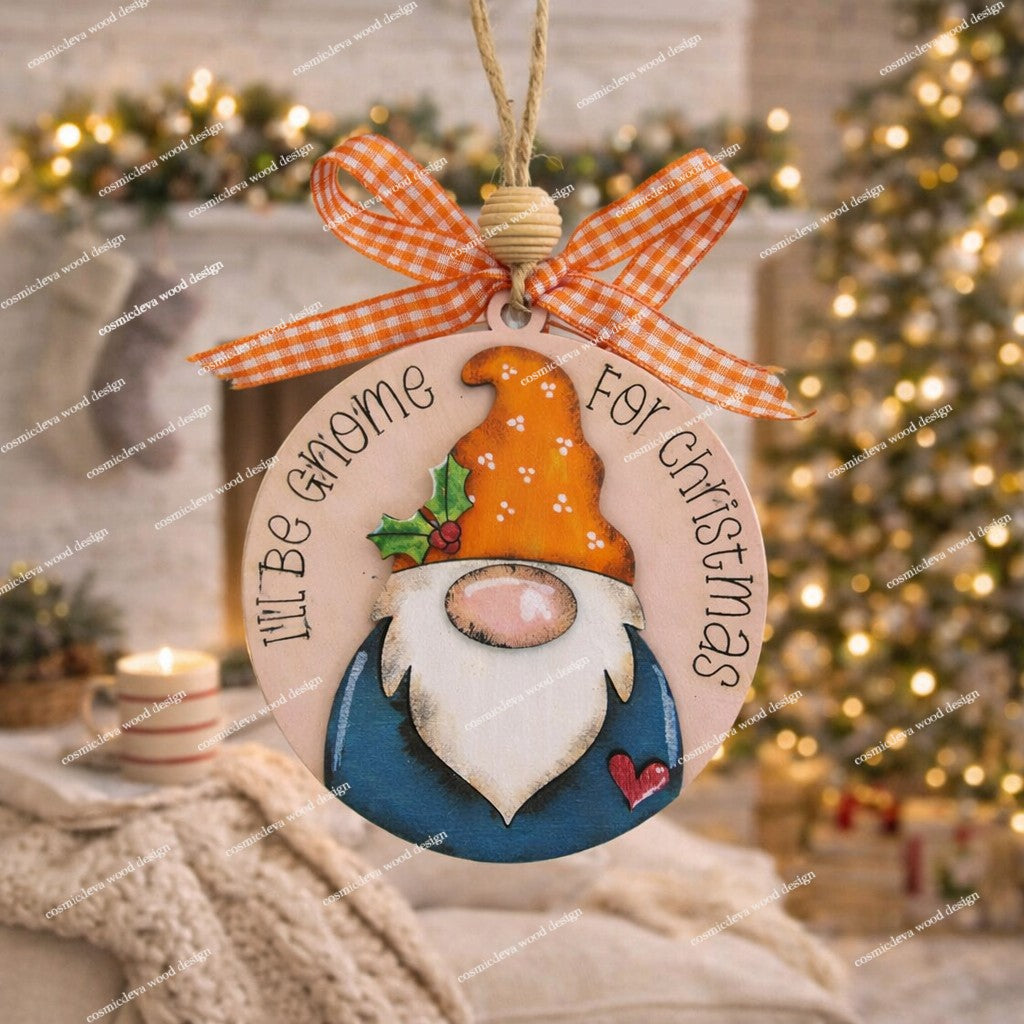 Handmade hand painted gnome Christmas ornament with engraved “I’ll Be Gnome for Christmas” text. Layered Baltic birch wood, rustic jute twine, wood bead, and bow. Cute holiday décor or gift.