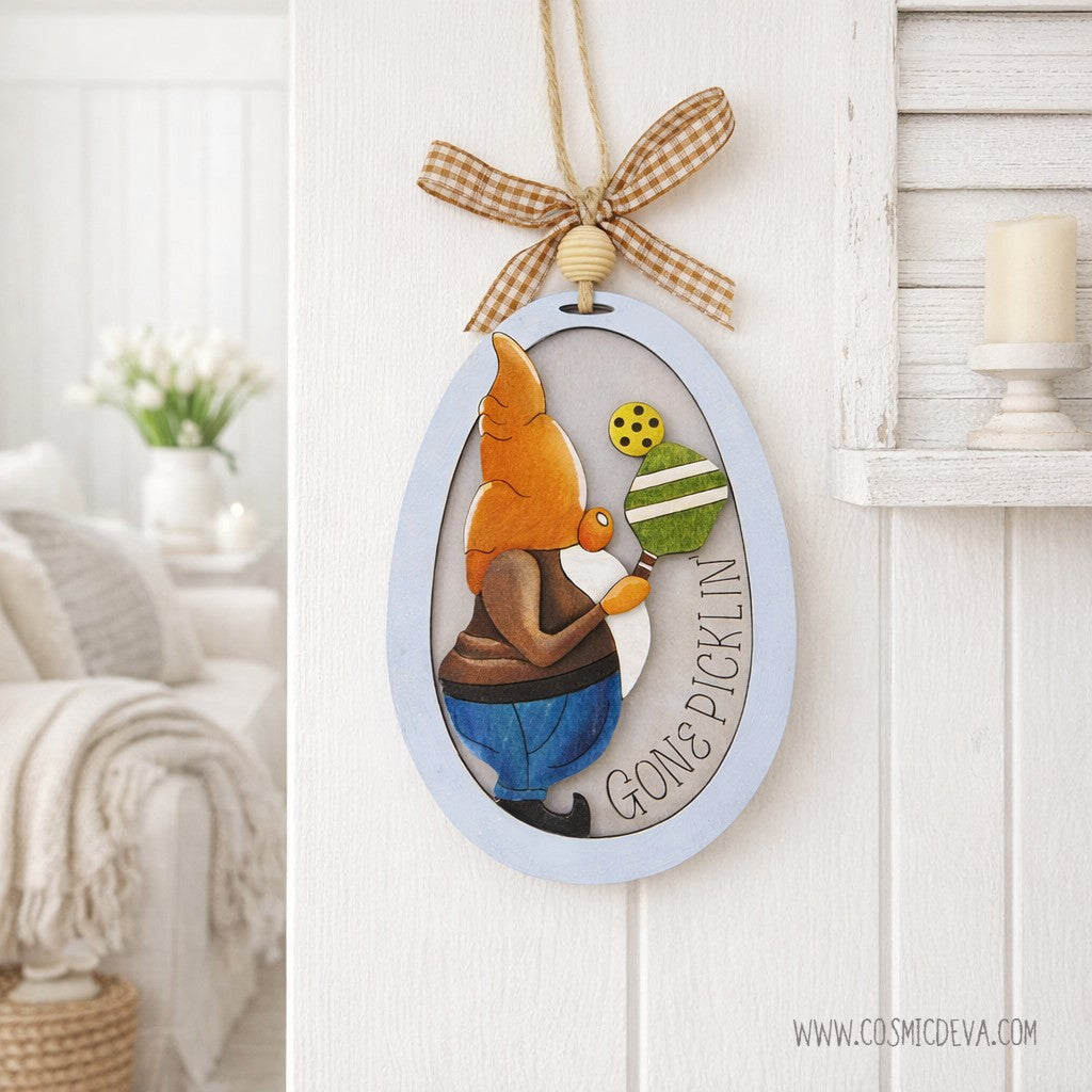Hand painted 3D Pickleball Gnome Ornament with orange cap. Layered birch wood décor for year round pickleball lovers. Great gift for players, coaches, and fans.