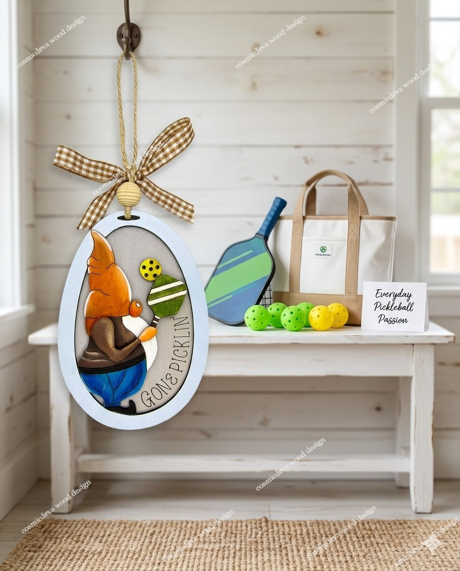 Hand painted 3D Pickleball Gnome Ornament with orange cap. Layered birch wood décor for year round pickleball lovers. Great gift for players, coaches, and fans.