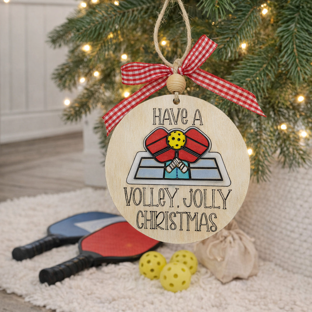 Celebrate the season with our 3D Pickleball Christmas Ornament! Hand-painted wood, layered depth, and "Volley Jolly" engraving. The perfect gift for pickleball lovers.