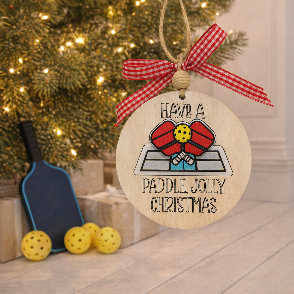 Celebrate the season with our 3D Pickleball Christmas Ornament! Hand-painted wood, layered depth, and "Volley Jolly" engraving. The perfect gift for pickleball lovers.