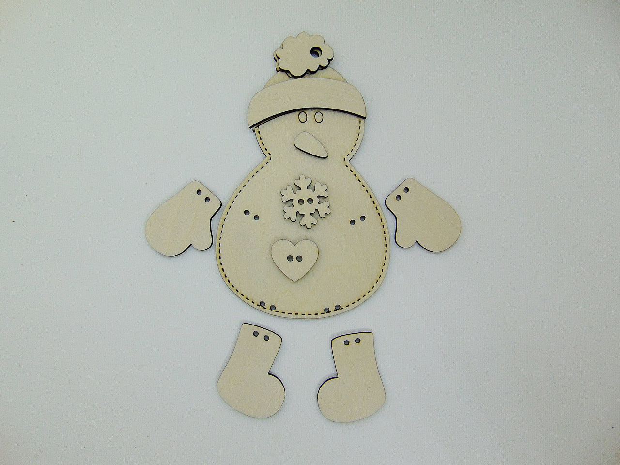 Handmade wooden stitched snowman ornament with fabric scarf, blue mitten, carrot nose, and hand painted layered details. Cute Christmas décor and winter holiday gift. DIY KIT