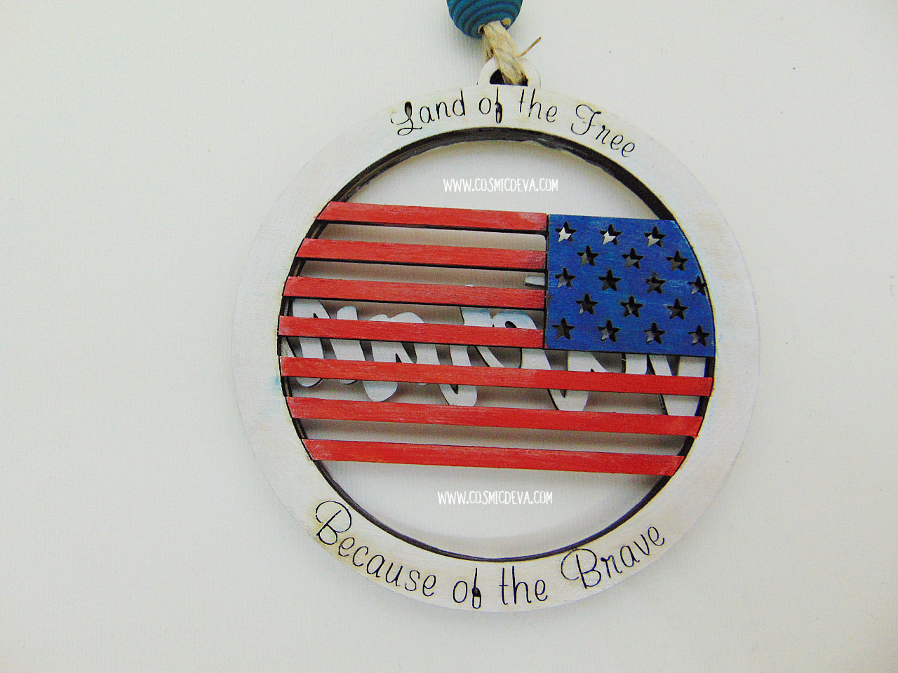 Honor a Veteran with this handmade 2 layer wooden ornament featuring a painted American flag, engraved tribute words, and double sided patriotic text. A meaningful military gift for Christmas, holidays, or year round appreciation.
