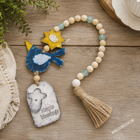 Handmade farmhouse wood bead garland with Simple Blessings sheep tag, blue bird, sun and jute tassel. Rustic tiered tray and cottage home decor.