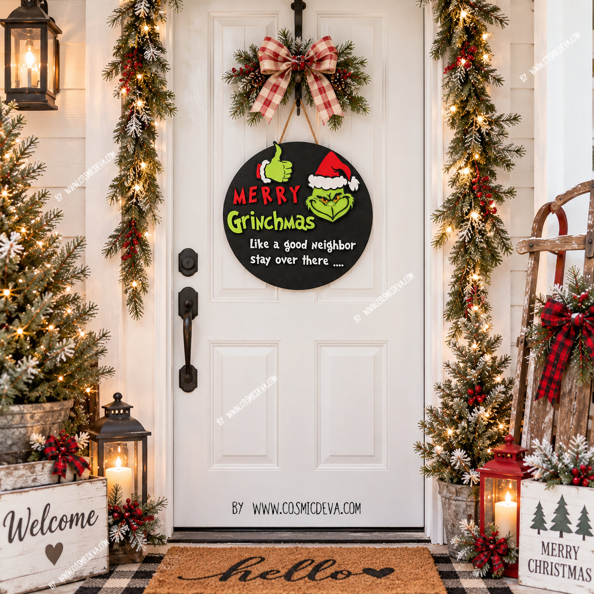 A festive front door decorated for Christmas, featuring a black circular sign with Grinch-themed artwork and the phrase 'Merry Grinchmas like a good neighbor stay over there.' The door is framed by garlands, lit trees, lanterns, and holiday decor.