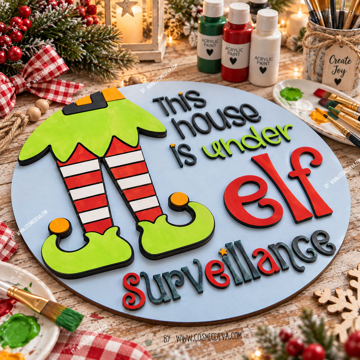 Handmade Elf Christmas door hanger featuring “This House Is Under Elf Surveillance.” Layered 3D wood sign in 12" or 14", hand painted in Alabama. By cosmicdeva